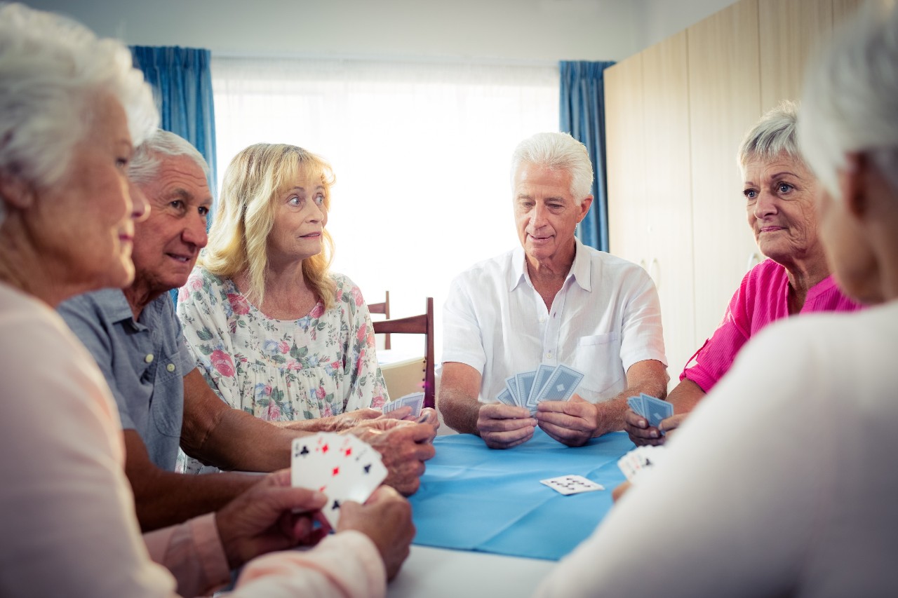 Group of seniors playing cards 746882