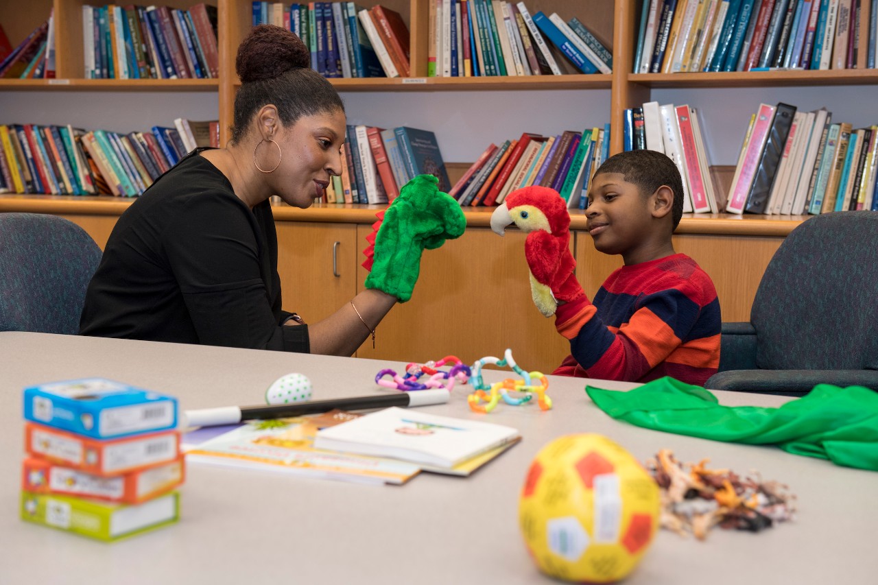 Dana Harley demonstrating play therapy. 