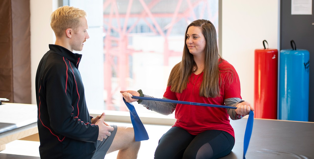 Two students in the Physical Therapy lab